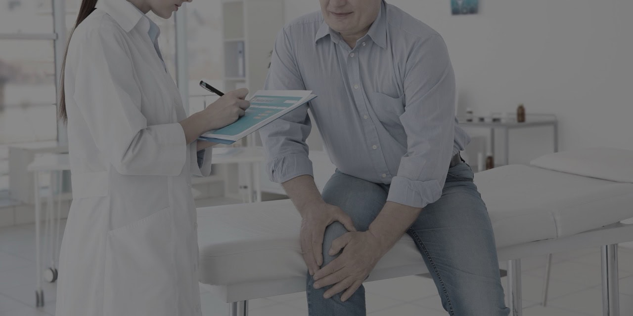 Doctor consulting with patient about pain management options.
