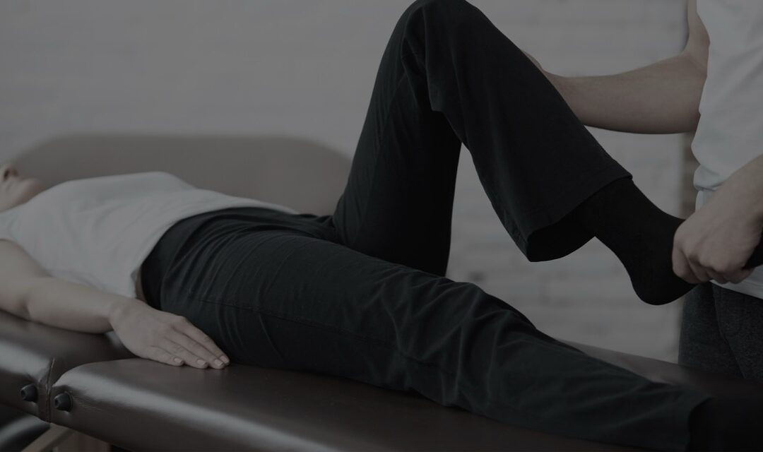 Patient receiving pain relief treatment from a healthcare professional.