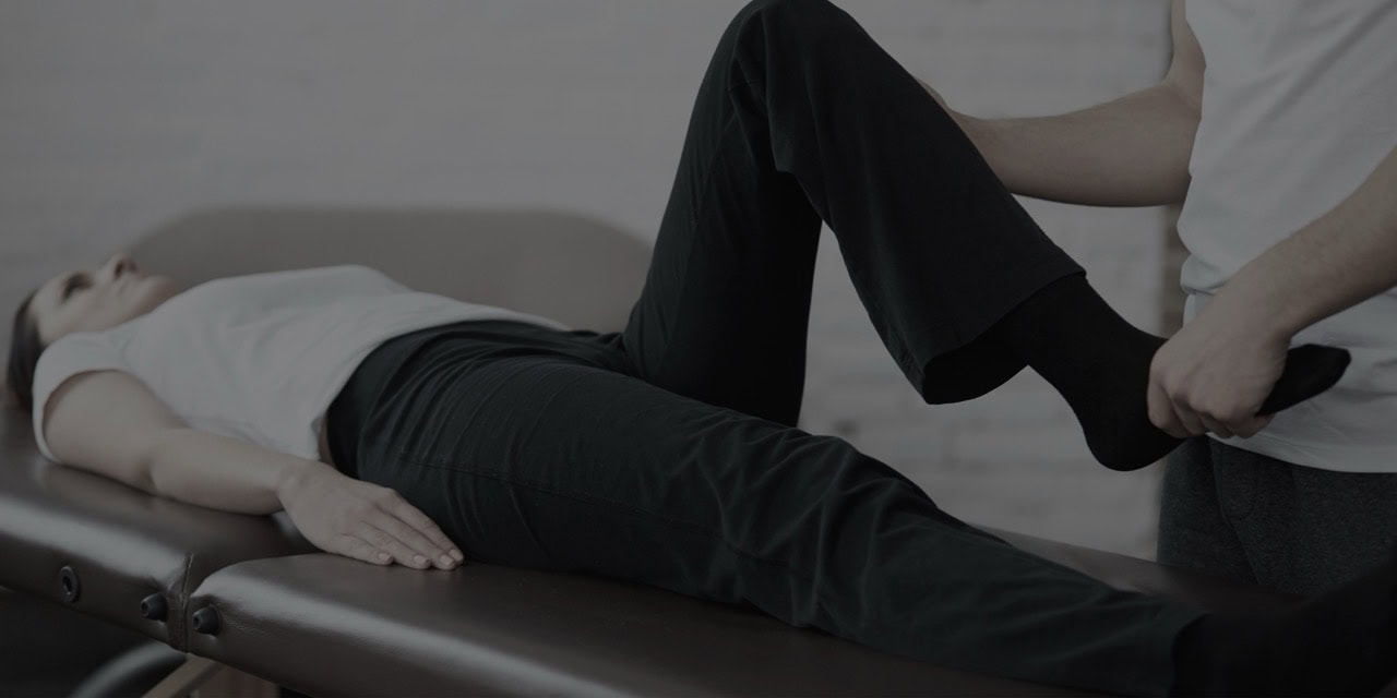Patient receiving pain relief treatment from a healthcare professional.
